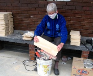 Millie sanded the seats and backs for 250 chairs.